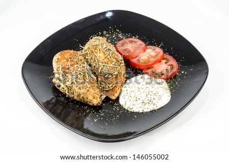Chicken meat dish / Light food - Plate with baked chicken, sliced ??tomato and white sauce - Isolated on white