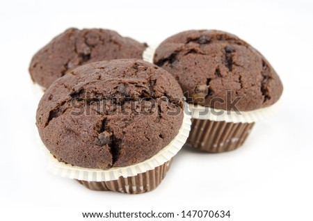 Chocolate muffins isolated on white / Sweet food - Dessert - Freshly baked chocolate chip muffins, isolated on white - American style