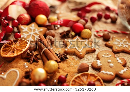 christmas baking ingredients - christmas gingerbread cookies, spices, nuts and fruits