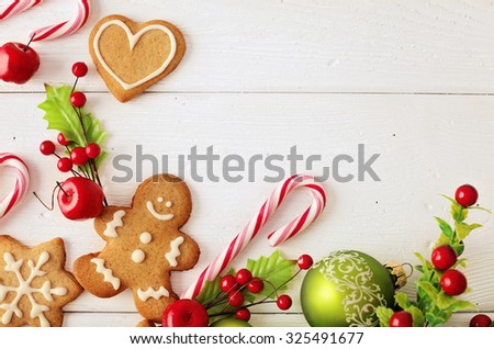 Christmas frame for greeting card with decorative christmas gingerbread cookies and ornaments