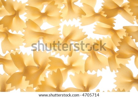 Pasta - uncooked pasta macro view, food ingredients. Raw farfalle