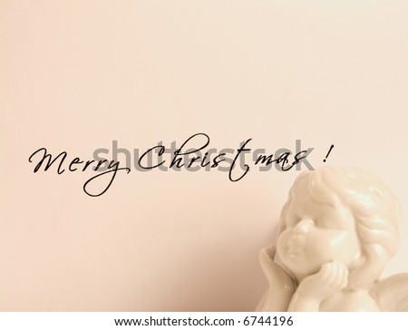 Christmas card. Holiday greetings on beige background with angel