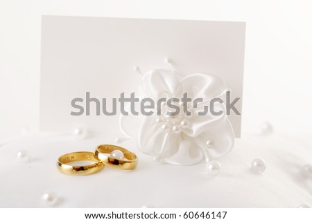stock photo two wedding rings and wedding invitation