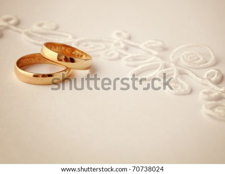 stock photo two wedding rings and wedding invitation