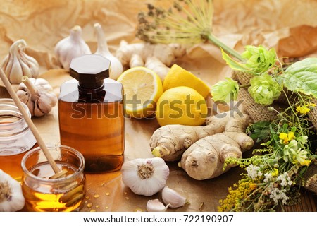 bottle of syrup, honey and herbs. alternative medicine