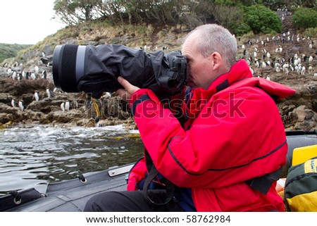 Bird watcher with camera The Snares Island, Sub-antarctic Islands, NZ
