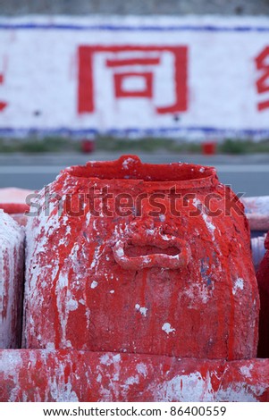 paint spilled over paint cans, China