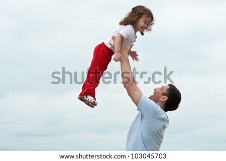 Happy little asian girl enjoying time with her daddy