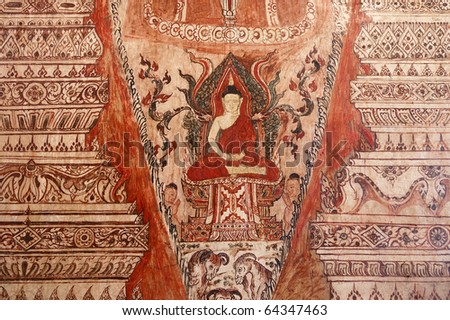 Ancient Thai Buddhist temple mural. Very old Thai Buddhist temple mural of Buddha painted in red and a yellow ochre / gold color in the main hall at Wat Kor, Phetchaburi, Thailand, Southeast Asia.