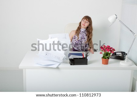 Exhausted business woman with annoying documentation