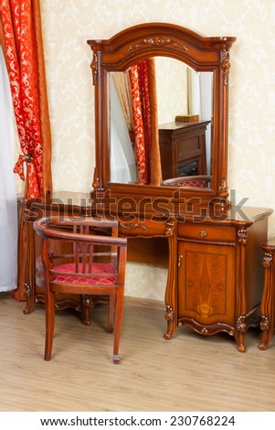 Vintage dressing table and a chair in front of it
