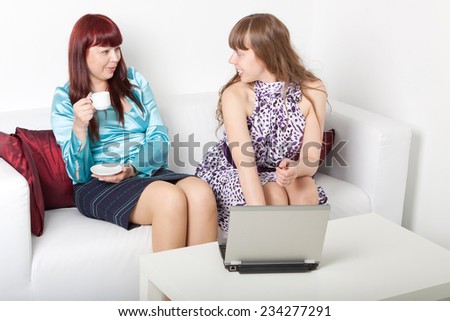 two woman converse