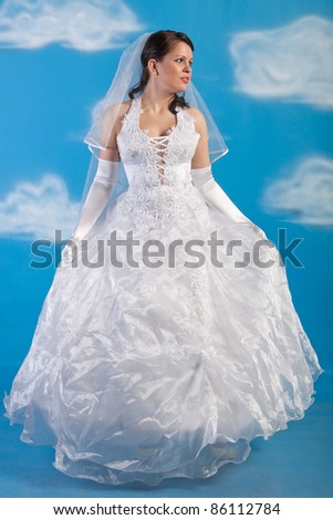 Full-length portrait of bride dressed in elegance white wedding dress