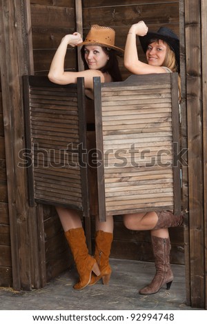 CowGirls standing in saloon entrance