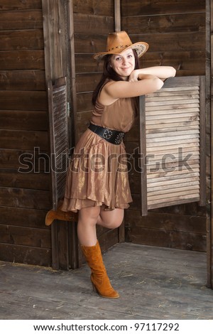 CowGirl standing in saloon entrance