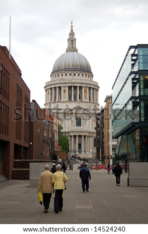 Saint Paul\'s Cathedral in London England with tourists walking past