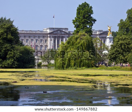 LONDON, UK - JULY 18, 2013: The view of Buckingham Palace from St. James\'s Park in London.