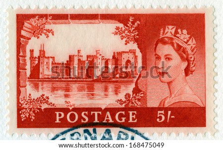 UNITED KINGDOM - CIRCA 1969: A vintage British postage stamp featuring a portrait of Queen Elizabeth II and Windsor Castle, circa 1969.