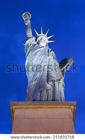 A replica of the iconic Statue of Liberty monument located by the Grenelle Bridge on the river Seine in Paris.