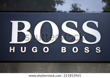 PARIS, FRANCE - AUGUST 4TH 2014: The sign for the 'Hugo Boss' store on Avenue des Champs-Elysees in Paris on 4th August 2014.  The Hugo Boss company was founded in 1924 and sells luxury high-fashion.