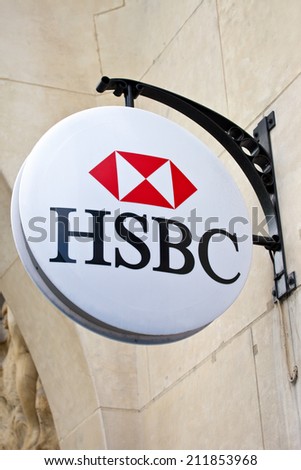 PARIS, FRANCE - AUGUST 4TH 2014: The sign for the \'HSBC\' bank on Avenue des Champs-Elysees in Paris on 4th August 2014.  Founded in 1865, HSBC is currently the world\'s second largest bank company.