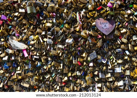 PARIS, FRANCE - AUGUST 4TH 2014: Love locks on the Pont des Arts in Paris on 4th August 2014.