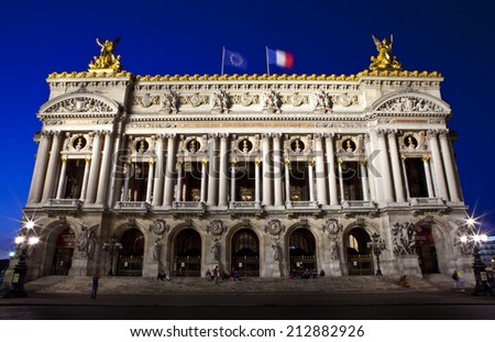 The magnificent Palais Garnier at dusk in Paris, France.  The Palais is a 1,979-seat Opera House built for the Paris Opera.