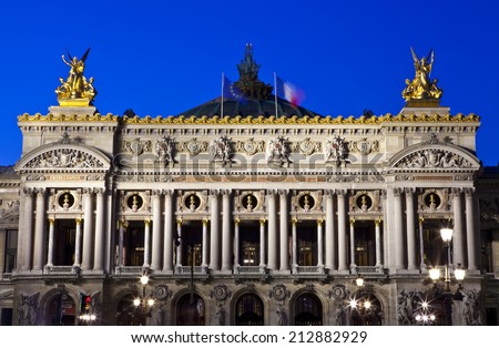 The magnificent Palais Garnier at dusk in Paris, France.  The Palais is a 1,979-seat Opera House built for the Paris Opera.