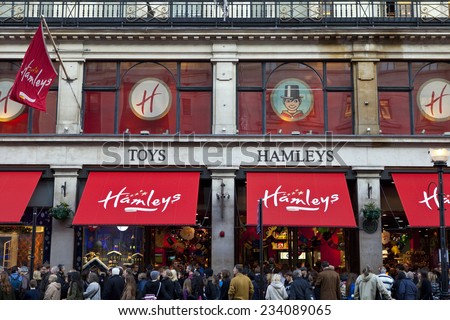 LONDON, UK - NOVEMBER 29, 2014: Shoppers flood past and into Hamleys Toy Shop on Regent Street in London, on November 29, 2014.  Founded in 1760, Hamleys is the oldest toy shop in the world.
