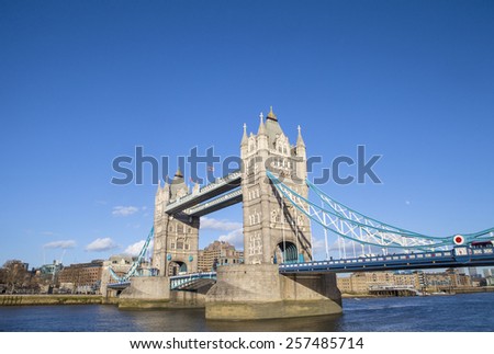 The beautiful architecture of Tower Bridge under a clear blue sky in London.