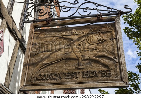 CANTERBURY, UK - JULY 19TH 2015: The sign for Conquest House in Canterbury, Kent on 19th July 2015.  The house was the meeting place of the four knights who killed Thomas Beckett in 1170.