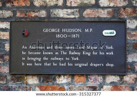 YORK, UK - AUGUST 25TH 2015: A plaque remembering the work of George Hudson M.P. in York, on 25th August 2015.
