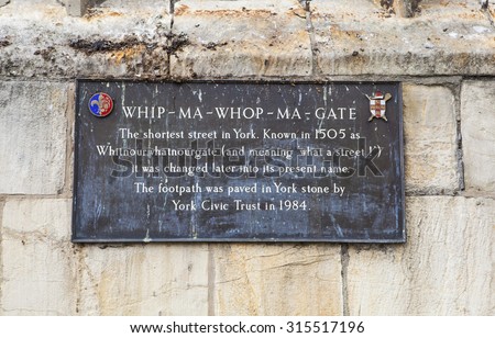 YORK, UK - AUGUST 26TH 2015: A plaque detailing the history of Whip-Ma-Whop-Ma-Gate in York, on 26th August 2015.