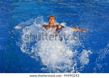Young man drowning in a water