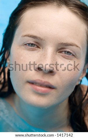 Sensual and wet young woman looking at you