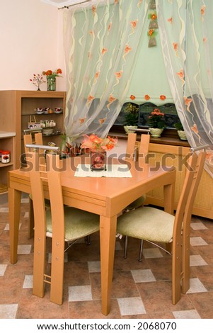 An kitchen table in the orange room