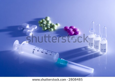 Syringe and some medicaments, used color filter on flash