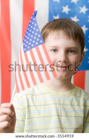 A boy waving with american flag, vertical