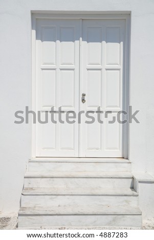 A photo of white door and stairs