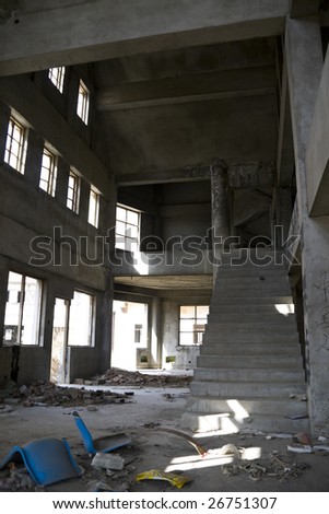 Abandoned house hall with staircase.