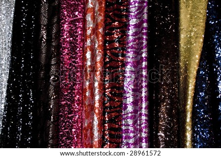 Bolts of shiny colorful taffeta with plastic piece
