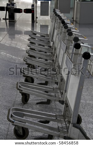 Row of luggage carts in the Beijing airport