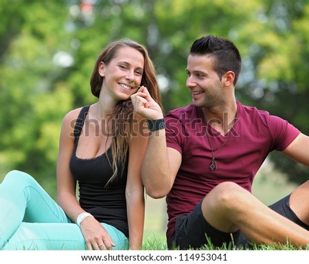 Handsome man playing with his girlfriend