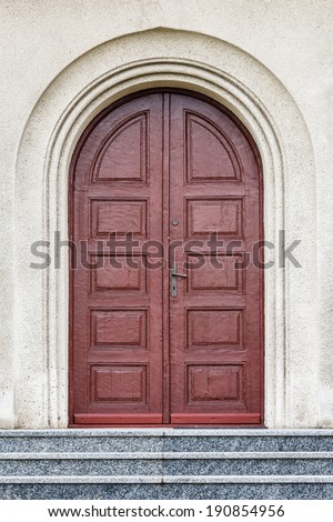 Old fashioned front door entrance, all in dark brown colors, Europe