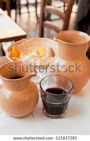 rural ceramic jugs with local red wine and water