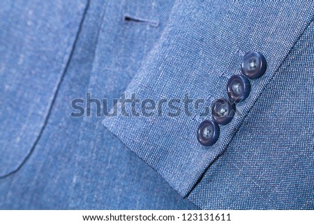 sartorial background - fragment of blue silk men's suit close up