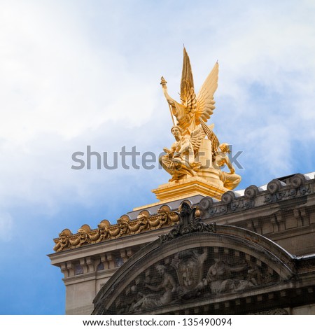 PARIS, FRANCE - MARCH 5: golden sculpture on roof of Paris Opera House in Paris on March 5, 2013. The golden figural group L Harmonie was made by sculptor Charles Gumery in 1869.