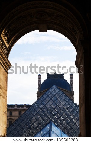 PARIS, FRANCE - MARCH 5: arch gate to Louvre Museum from Place du Palais Royal. The museum opened on 10 August 1793 with an exhibition of 537 paintings in Paris, France on March 5, 2013