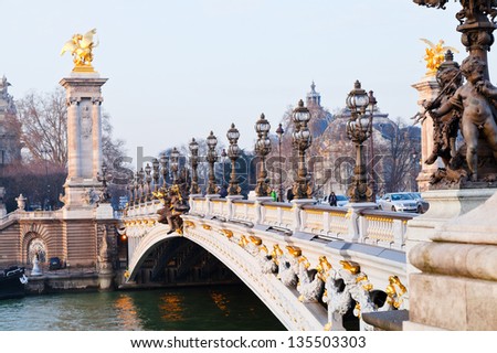 PARIS, FRANCE - MARCH 4: Pont Alexandre III. The bridge, with its Art Nouveau lamps, cherubs, nymphs and winged horses at either end, was built between 1896 and 1900, in Paris, France on March 4, 2013