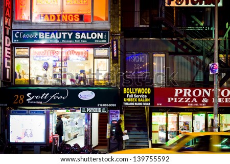 NEW YORK, USA - FEBRUARY 4: multinational immigrant's stores in New York at night on February 4, 2010. 36% of the population of New York City are immigrants and they speak as many as 800 languages.